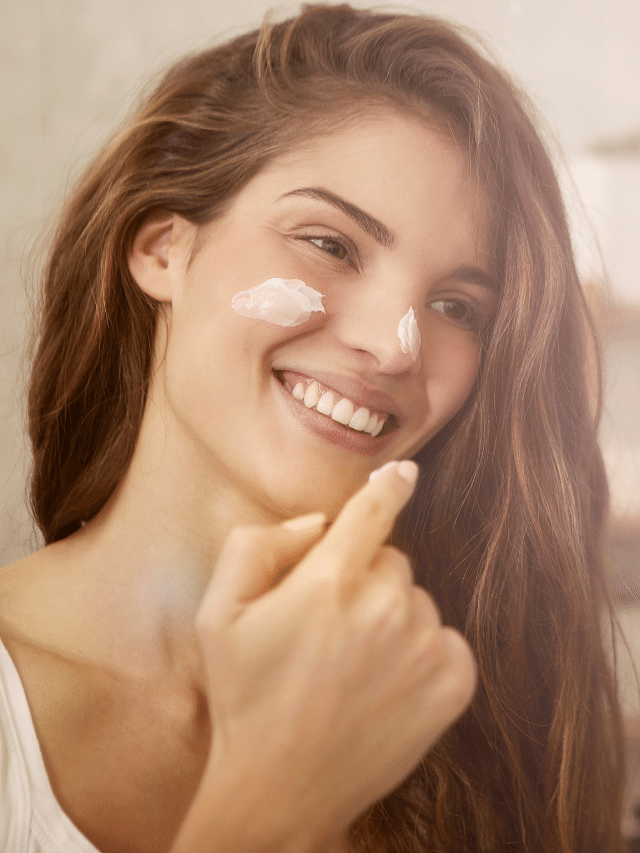 woman putting on lotion before the sauna