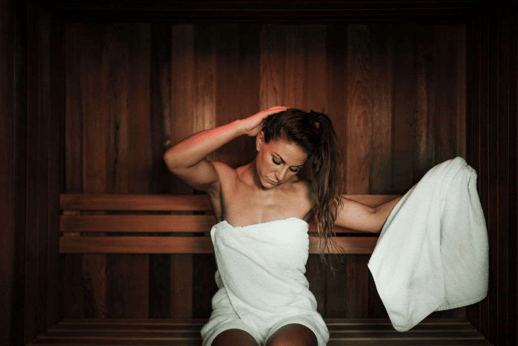 girl feeling some of the risks of using infrared sauna