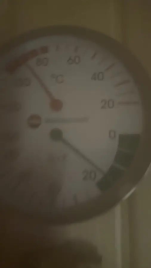 Wall thermometer in our basement sauna showing about 90 °C